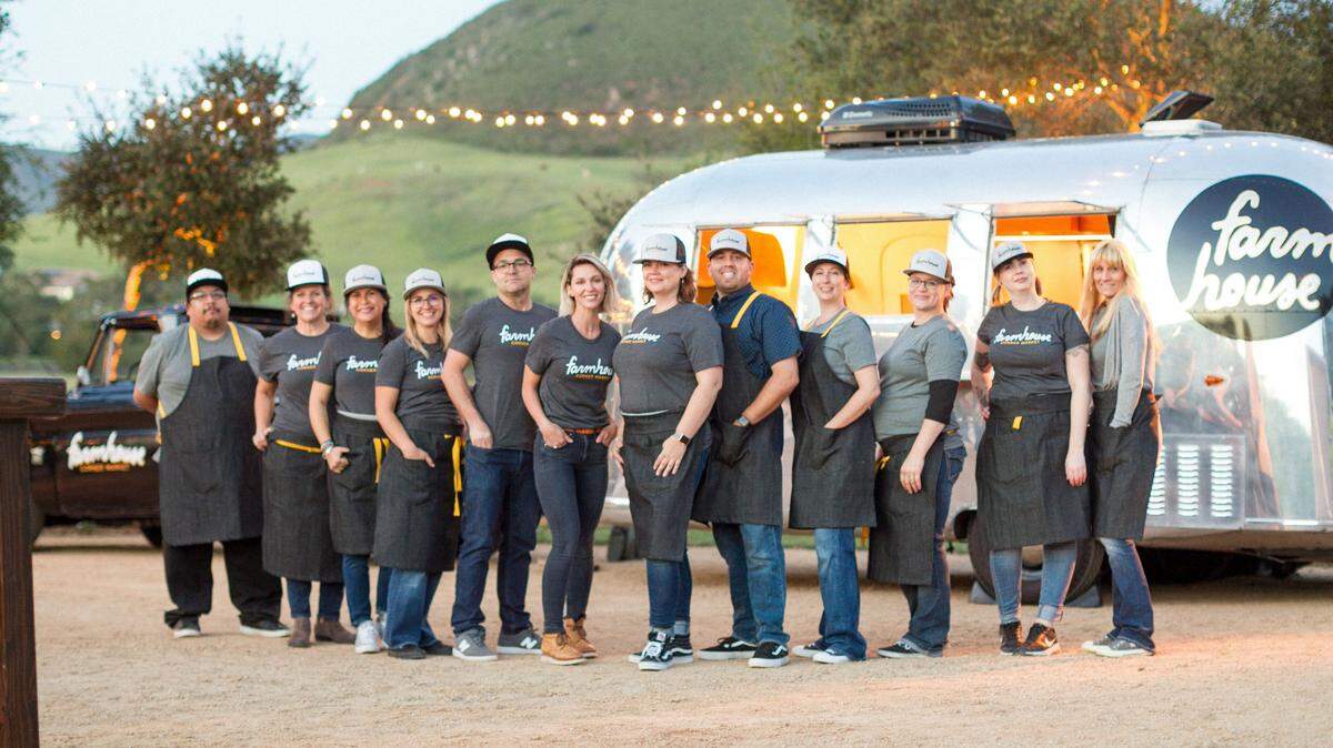 Farmhouse Corner Market is co-owned by two couples: Will and Kari Torres, and Ryan and Leanne Harris, shown at center, left to right. 
Farmhouse currently operates as a catering service and a food truck in an Airstream trailer. The Torreses operate the catering services.