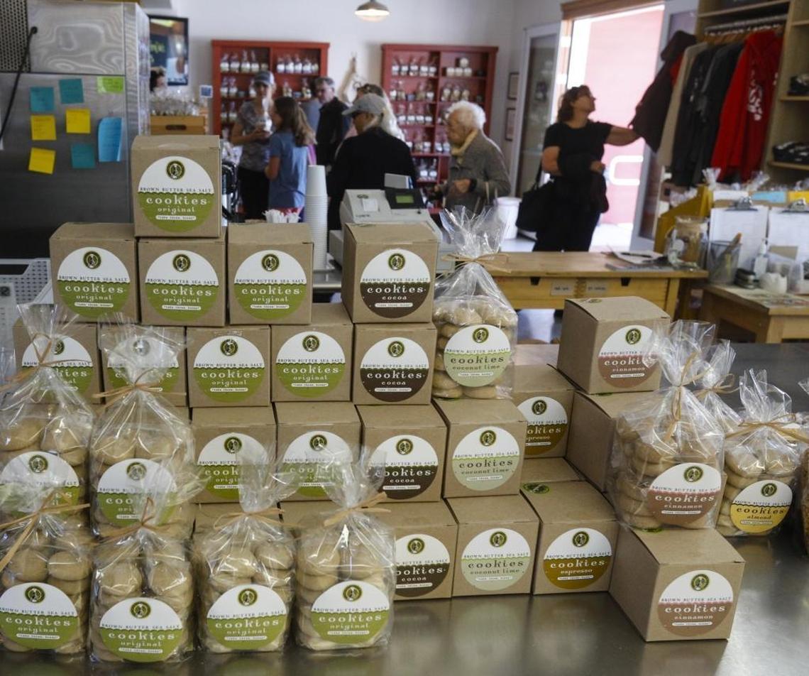 Shoppers taste samples and watch cookies being baked and packaged at the Brown Butter Cookie Co. store in Cayucos.