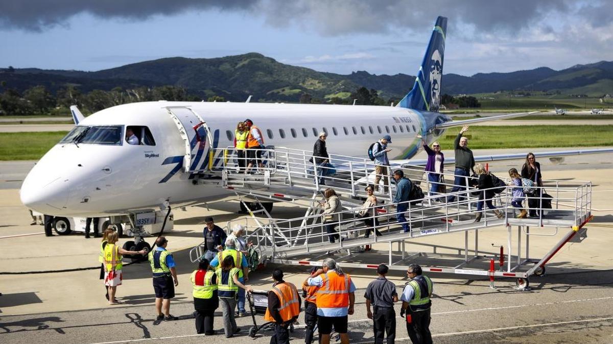 Passengers disembark from the first Alaska Airlines flight arriving at the San Luis Obispo County Regional Airport from Seattle on Thursday, April 13, 2017.