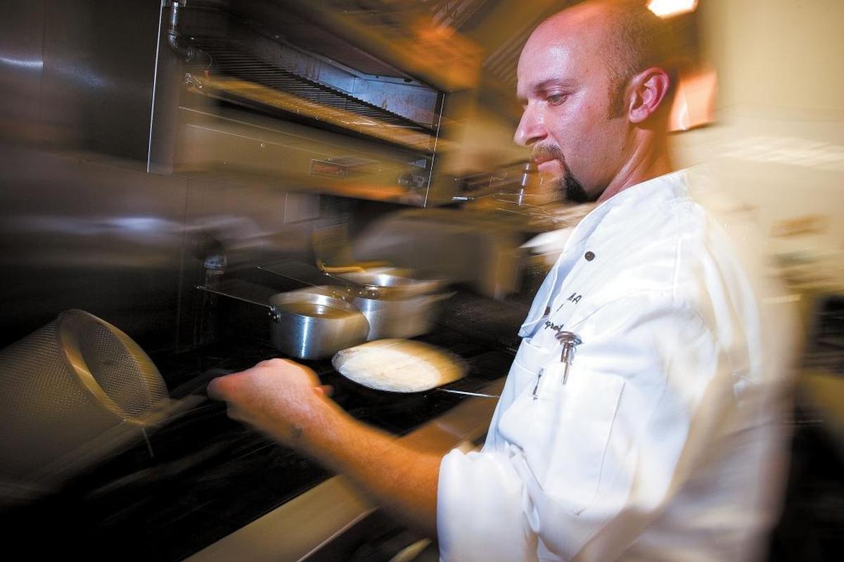 Nicola Allegretta, co-owner and chef at Mama’s Meatball, prepares the Ravioli di Zucca.