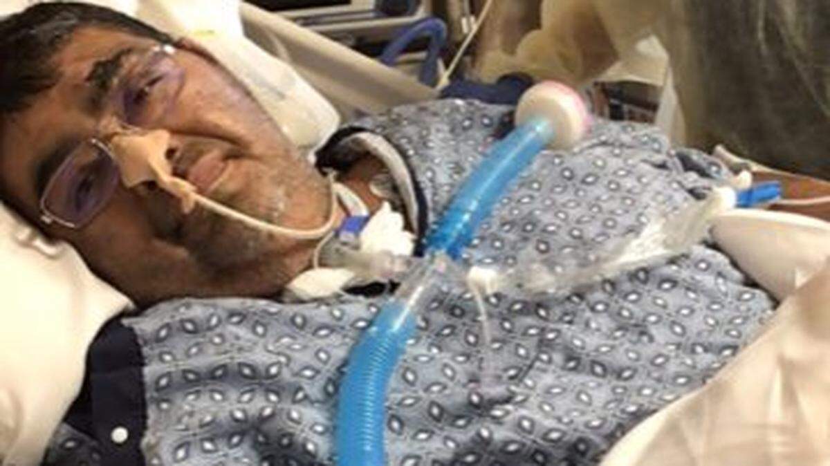 Leon Castillo, co-owner of Popolo Catering in San Luis Obispo, is seen in the hospital in 2020 while battling COVID-19.