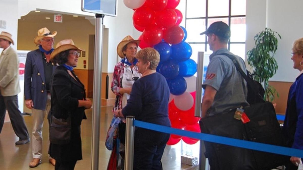 Santa Barbara Mayor Helene Schneider welcomes travelers arriving Thursday on the first direct flight from Dallas, Texas.