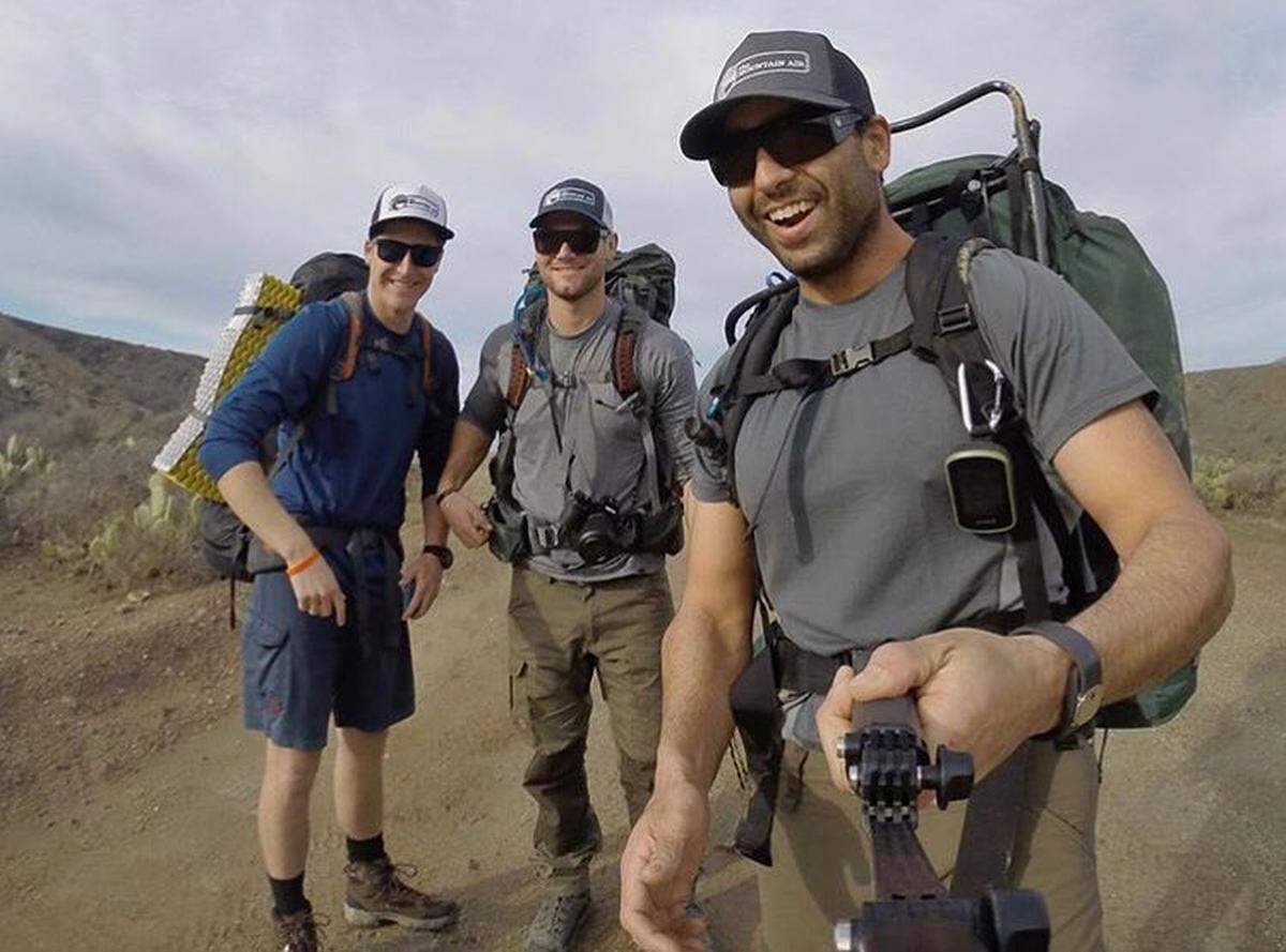 Hikers explore the Trans-Catalina trail, donning The Mountain Air hats.
