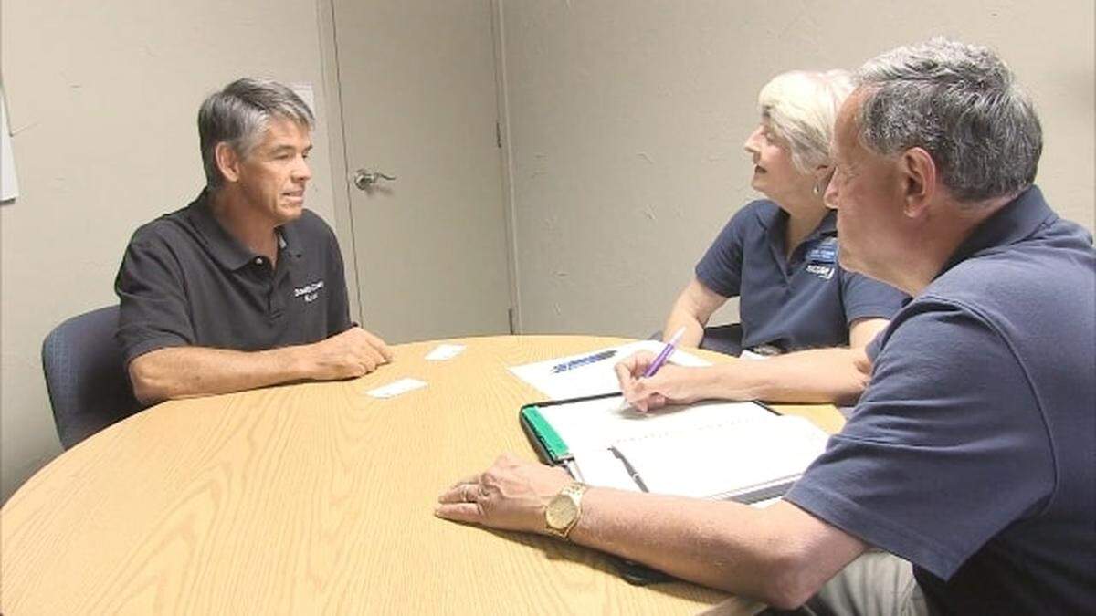 SCORE mentors meet with a business owner.