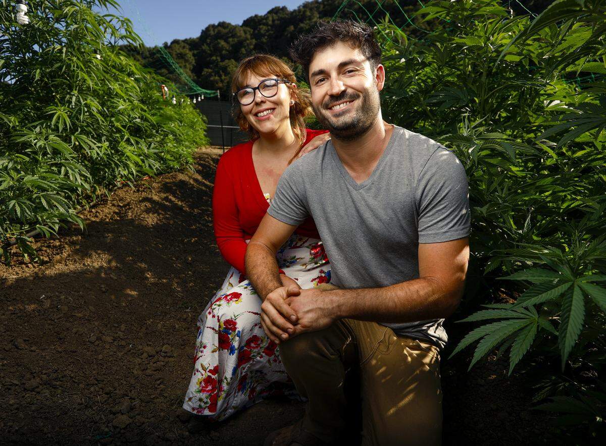 Megan’s Organic Market owners Megan Souza and Eric Powers, seen here at their marijuana farm in Los Osos in November 2018.
