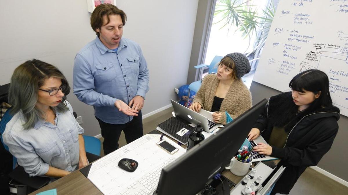 From left: Lea Brandy, account director, leads a conference call with Chris Zacker, Amanda Peterson and Kristen Kumagai at Matchfire. The San Luis Obispo-based firm offers creative services, data analytics, branding, design, digital marketing, mobile app development and nonprofit fundraising.