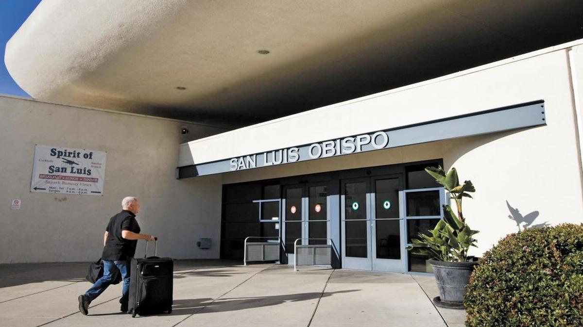 A passenger enters the San Luis Obispo County Regional Airport terminal. A new terminal is being built, and the airport is looking to lease the old terminal to an aviation-related business.