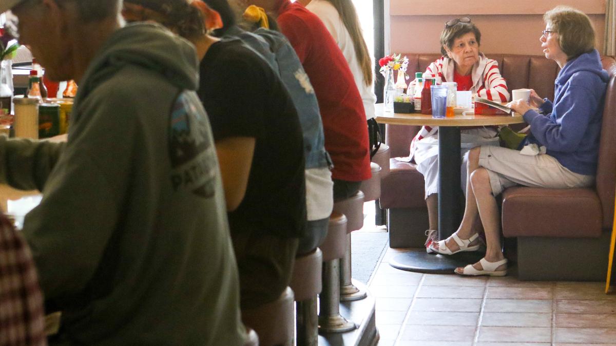 Rachel Abeyta, at booth left and Mary Steinwinters have breakfast at Louisa’s Place. 8-6-2019 David Middlecamp