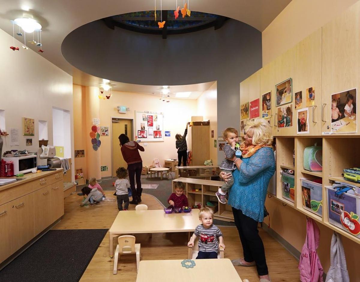The Willow Room at MindBody’s child care center is for 18- to 36-month-olds and has a port in the ceiling where parents can look in on their kids from the work area above.