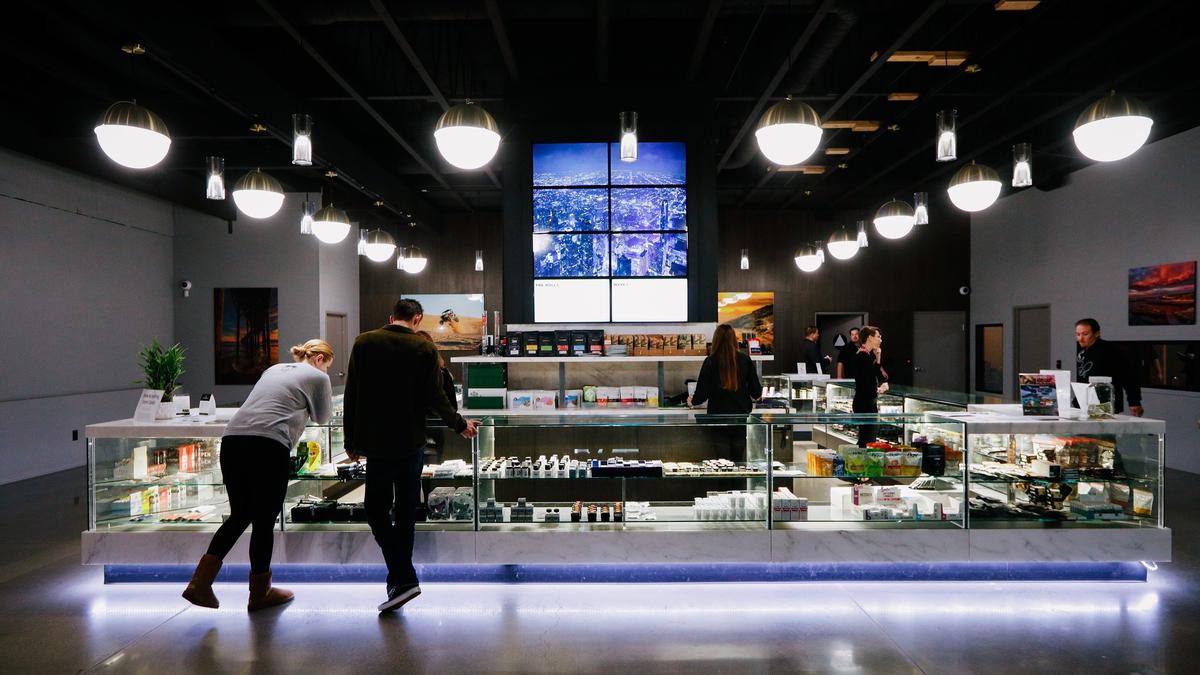 Customers browse the store at Natural Healing Center, a cannabis dispensary in Grover Beach, which continues to be in operation.