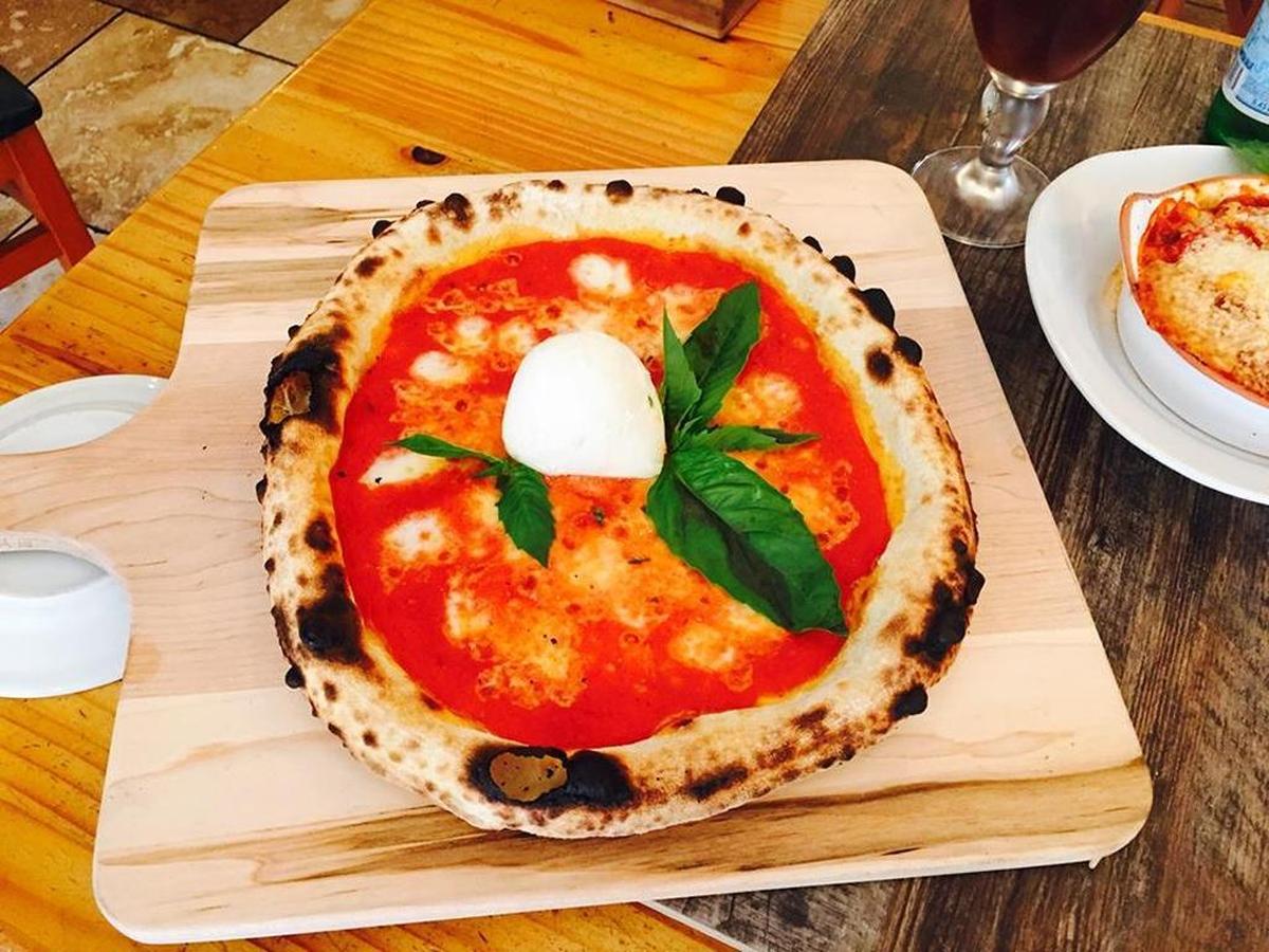 Flour House’s Queen Margherita pizza includes a San Marzano tomato sauce, buffalo mozzarella, Parmesan cheese and fresh basil.