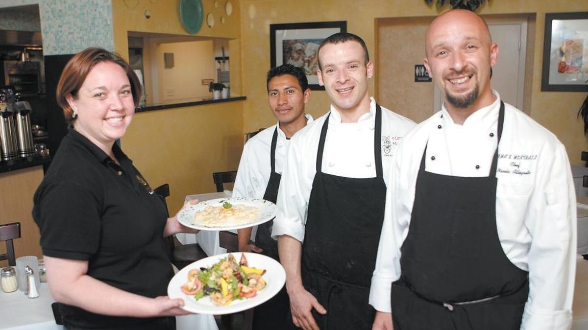 A 2008 photo shows Mama’s Meatball employees (from left to right) Julie Woosley, Jos Martines Rosas, Luca Allegretta, and Nicola Allegretta.