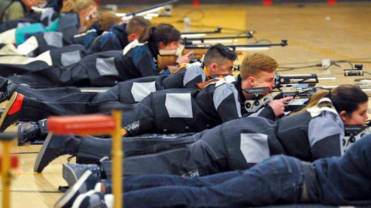 A group of JROTC shooters compete during the 2018 New Mexico Junior Olympic Qualifier for sport and precision air rifles at Cibola High School in Albuquerque, N.M. The National Rifle Association has given more than $7 million in grants to hundreds of U.S. schools in recent years, typically used for JROTC programs.