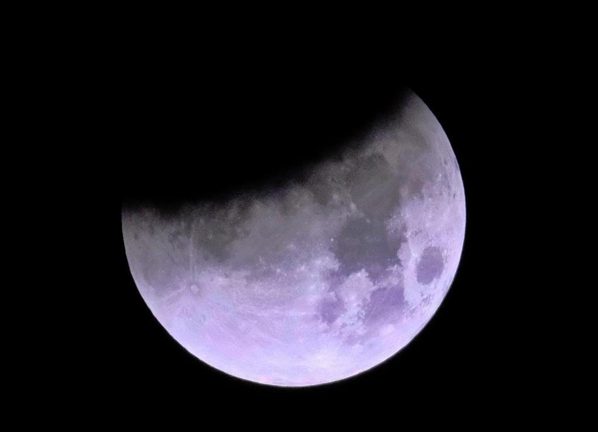 The shadow of the earth passes through the moon during a total lunar eclipse over Los Angeles on Wednesday Jan. 31, 2018.