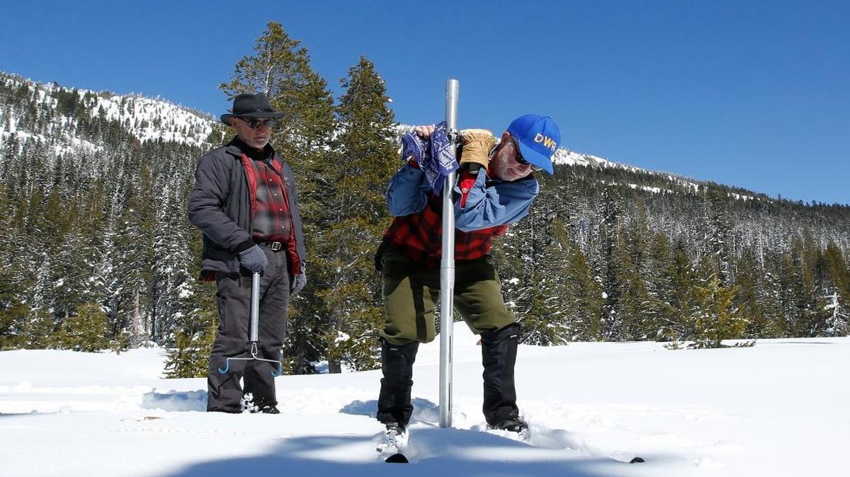 Frank Gehrke, right, chief of the California Cooperative Snow Surveys Program for the Department of Water Resources, plunges the survey tube into the snowpack as he conducts the third manual snow survey of the season at Phillips Station on Wednesday, March 1, 2017, near Echo Summit in the Sierra Nevada.