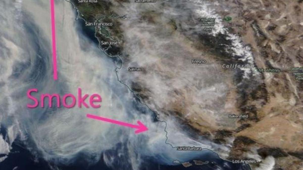 In this NASA satellite image taken Monday, smoke from the Thomas Fire can be seen spreading along the coast as far up as Eureka.
