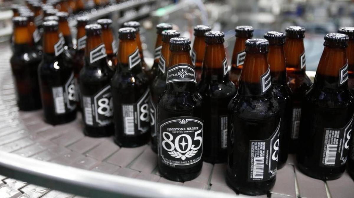 805 bottles move to cases on the bottling line at Firestone brewery. On Wednesday, a big-rig crash caused dozens of cases of Firestone beer to tumble out onto the side of Highway 101 in Salinas.