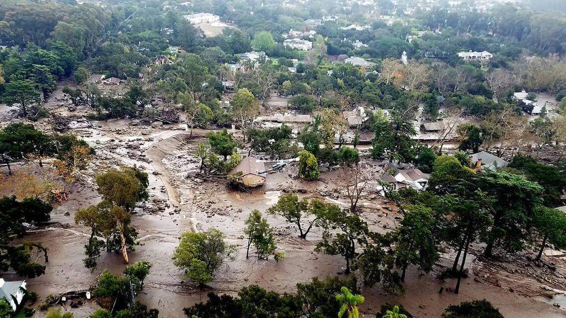 This file photo provided by the Santa Barbara County Fire Department shows mudflow and damage to homes in Montecito, California, on Jan. 10, 2018.