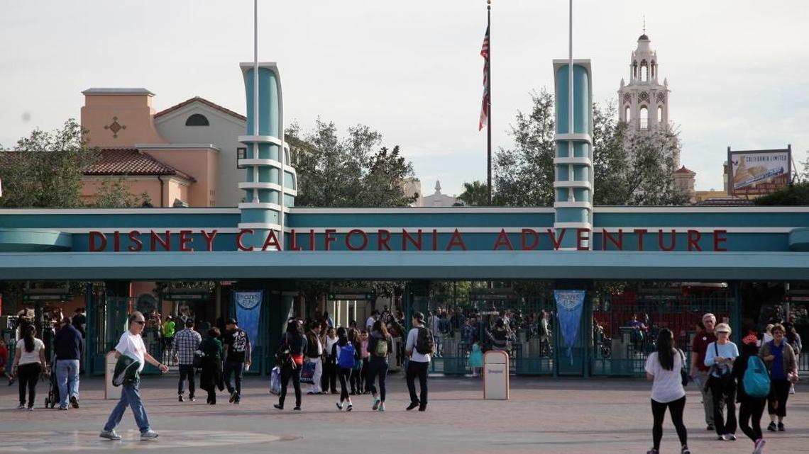 Visitors walk through the entrance to the Disney California Adventure theme park.