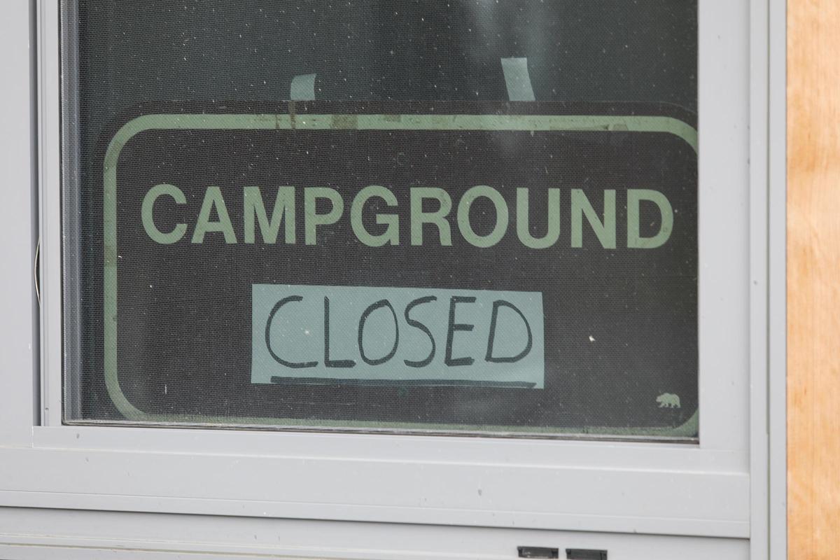 A sign is seen in the window of the Pismo State Beach campground’s kiosk. Campgrounds at San Luis Obispo County, California, are closed due to coronavirus but outdoor state parks, beaches and trails remain open. Campsites in SLO County are not taking reservations during COVID-19.