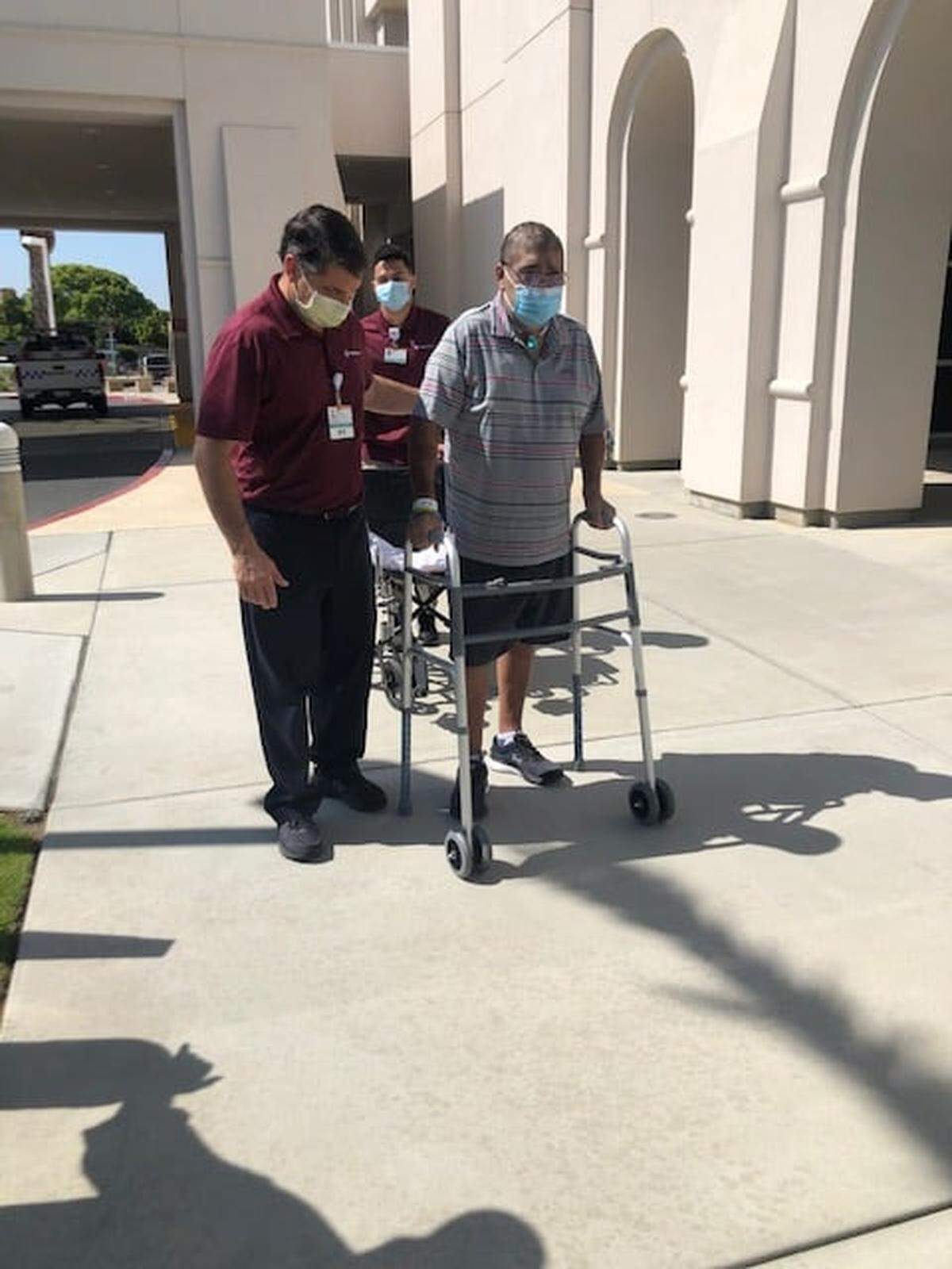 Leon Castillo, owner of Popolo Catering in San Luis Obispo, uses a walker as he undergoes rehabilitation after contracting COVID-19.