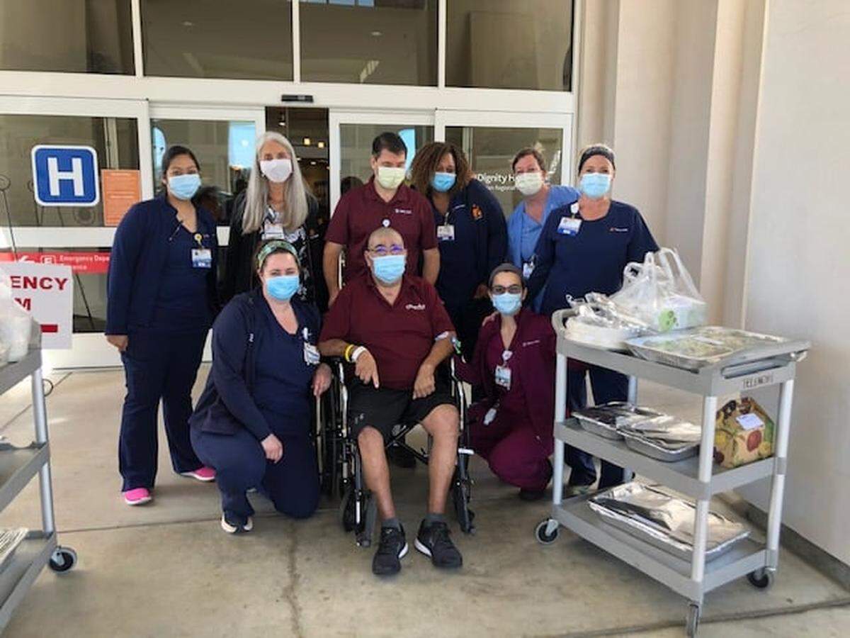 Leon Castillo poses for a picture with Marian Regional Medical Center staff in Santa Maria who helped him overcome COVID-19.