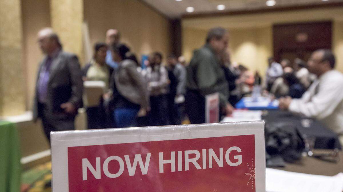 A “Now Hiring” sign at the San Jose Career Fair in San Jose, California.