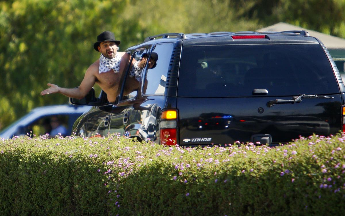 The driver of a dark colored Chevy Tahoe engaged with officers at the Grand Ave. entrance to Cal Poly during a pause in the slow speed chase around San Luis Obispo which ended with his arrest by CHP near Cal Poly Thursday morning.