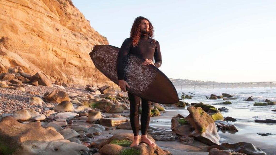 Cliff Kapono, a biochemist heading up the Surfer Biome Project, is shown at Blacks Beach, a popular surf spot, in La Jolla on March 31, 2017. Researchers are studying the effects of antibiotic-resistant genes in the oceans.