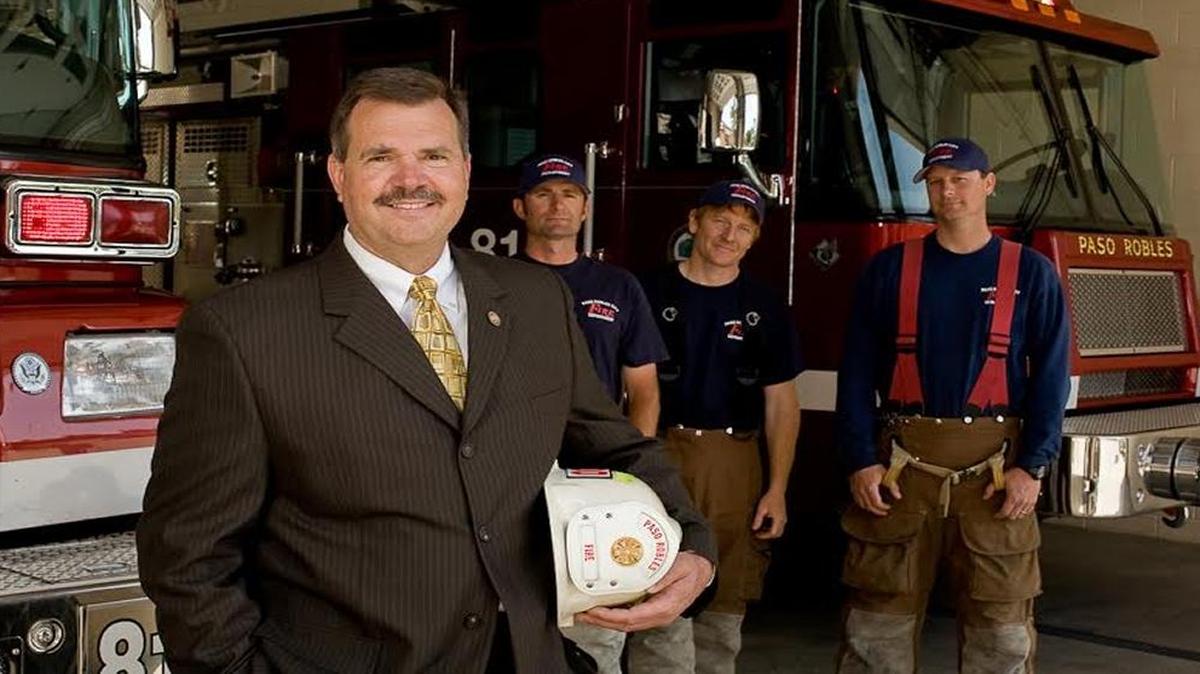Retiring Paso Robles Fire Chief Ken Johnson with firefighters.