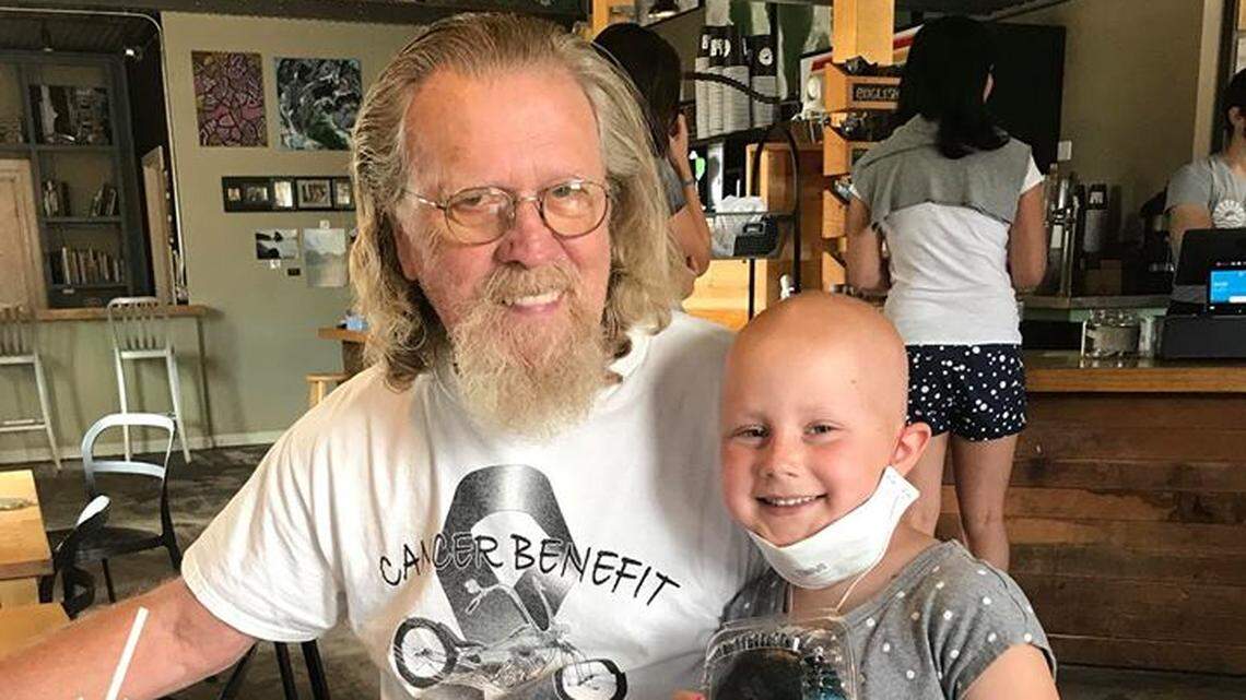 San Luis Obispo resident Claire Noland, 6, was diagnosed with cancer six months ago. Atascadero resident Tom Weatherman, left, bought Claire a doughnut at SLO Donut Co. on July 19 to celebrate optimistic lab results; on Wednesday, July 25, she was told she is cancer free.
