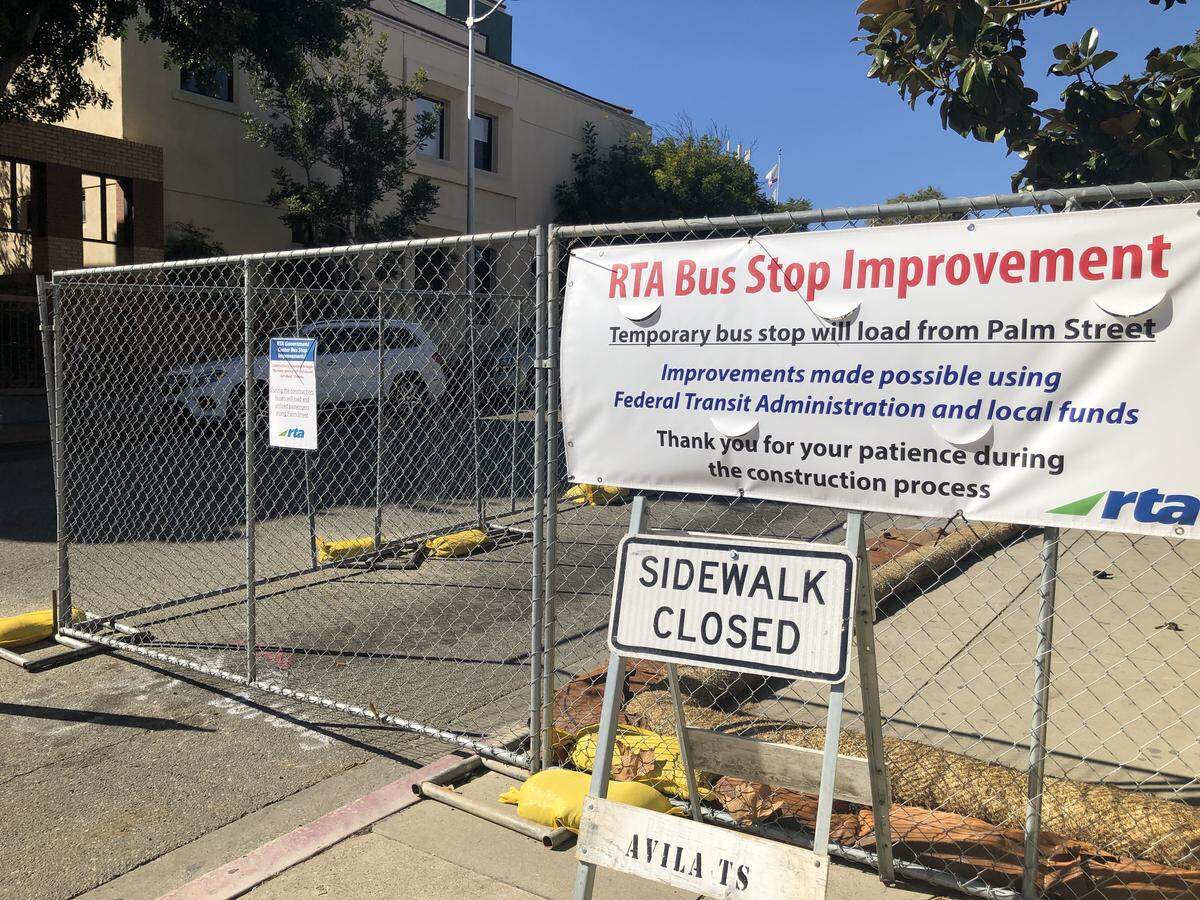 A section of Osos Street in downtown San Luis Obispo has been fenced off as part of a work on a bus transit center. The work has been put on hold pending investigation of potential historical artifacts.
