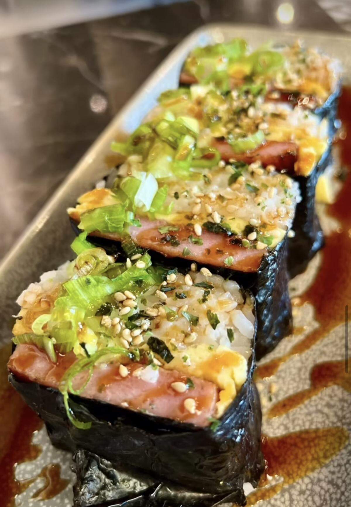 Customers at Kula Hawaiian Kitchen can enjoy a traditional Hawaiian dish called spam musubi. 