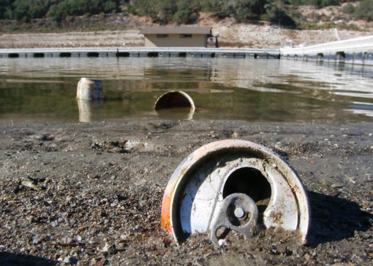The Lopez Lake shoreline at a low level in 2016, exposing once submerged trash
