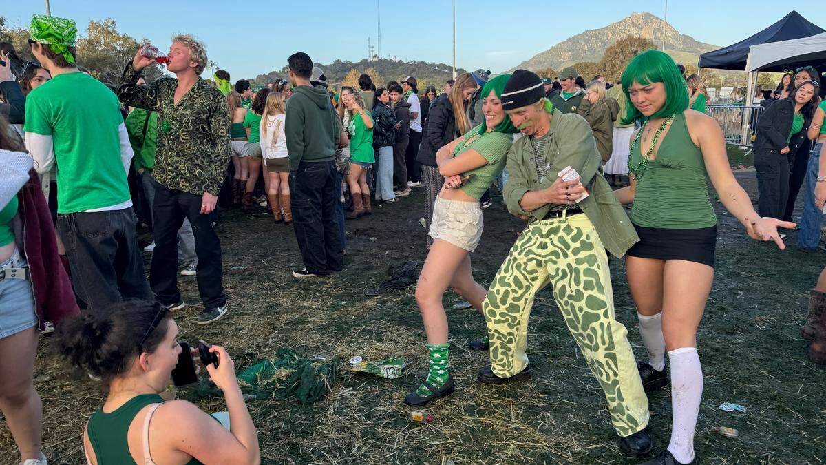 Students pose for photos at Cal Poly’s “Morning on the Green” music festival — its alternative to St. Fratty’s Day in the streets — on March 15, 2025.