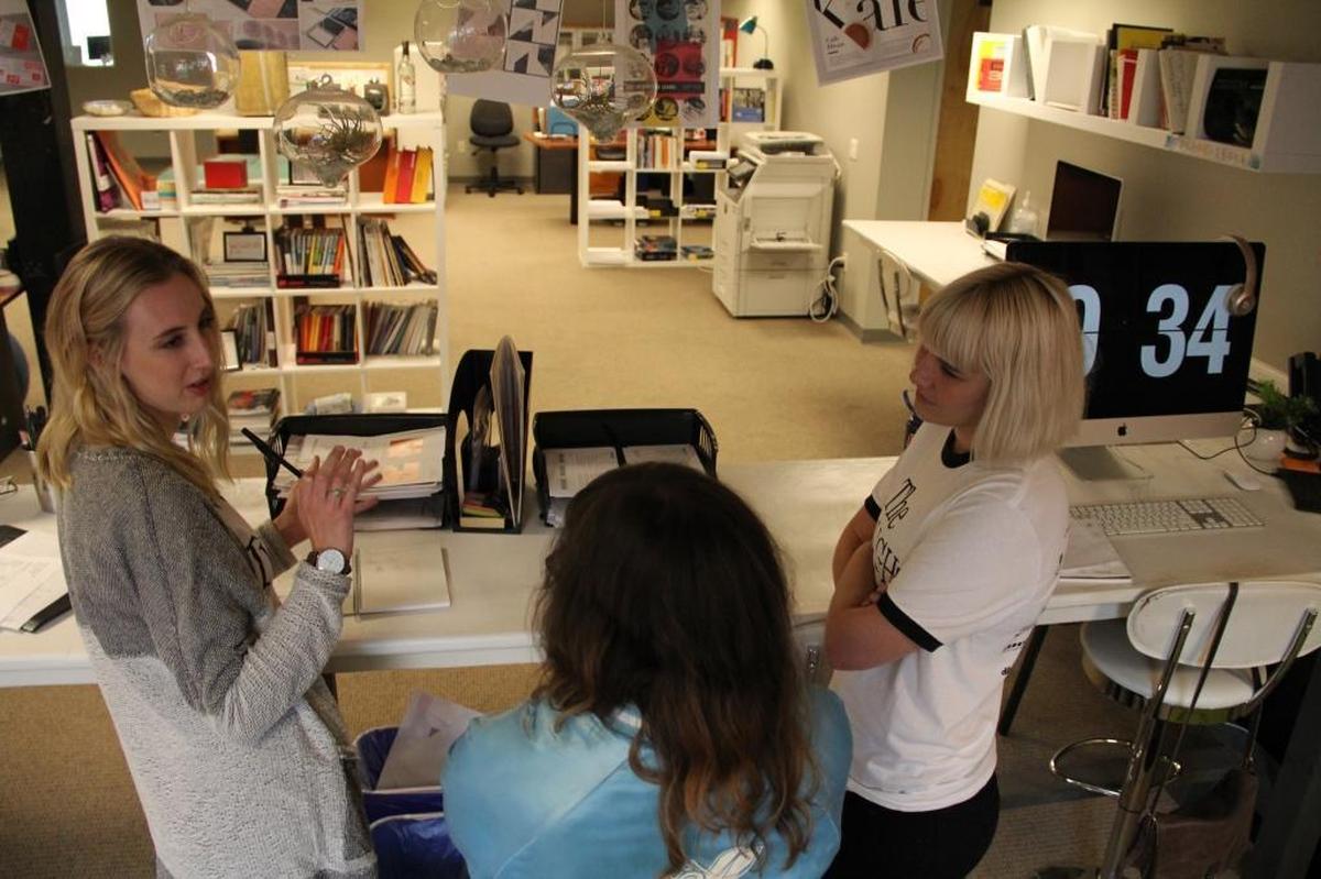 The Verdin design team, from left, Katie Pedersen, Megan Condict and Liz Tuck, discuss logo ideas.