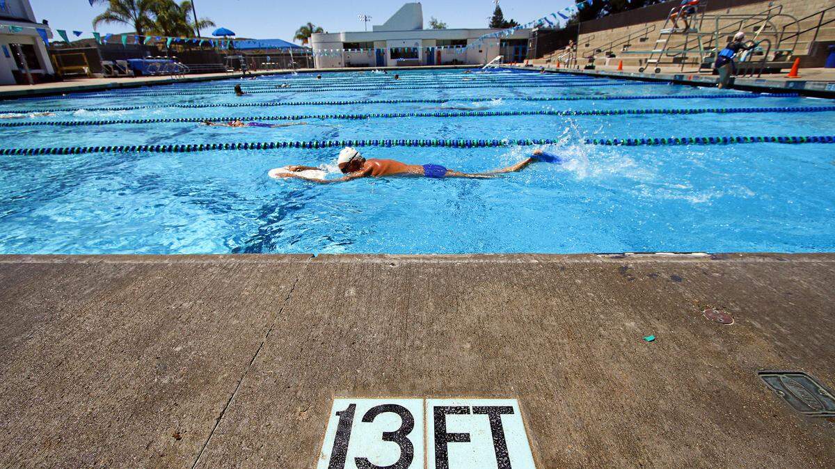A swimmer does laps at the SLO Swim Center.