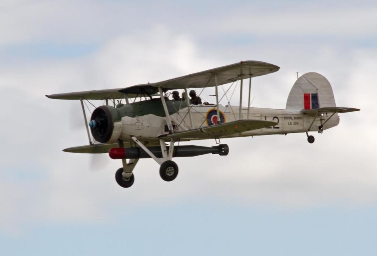 One of a handful of remaining operable Fairey Swordfish torpedo bombers is seen in flight in 2012. The British biplane was a workhorse during World War II.