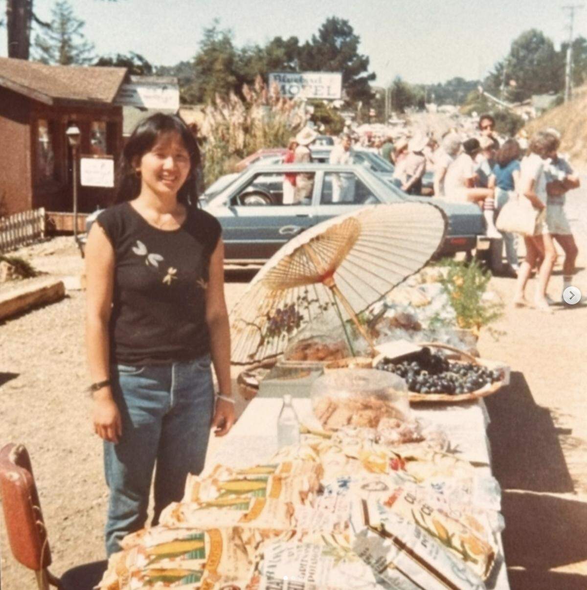 Shanny Covey in the early days of the culinary empire she and Robin Covey created together in San Luis Obispo County. Here, in 1983 or so, she’s participating in a farmer’s market in Cambria, displaying items from their tiny Robin’s Nest health food store and garden cafe.
