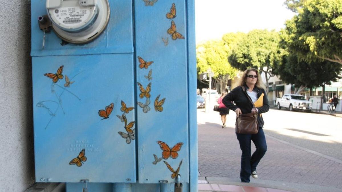 A utility box at the corner of Osos and Higuera in downtown San Luis Obispo. Artist Lynn Hessler painted monarch butterflies on it.