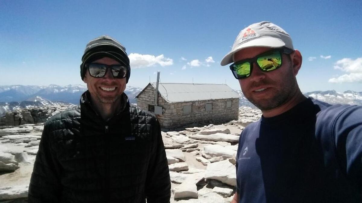 Brian McKinney, left, and Sam Vonderheide reached the summit of Mt. Whitney after they encountered a mountain lion on their 11-day backpacking trip.