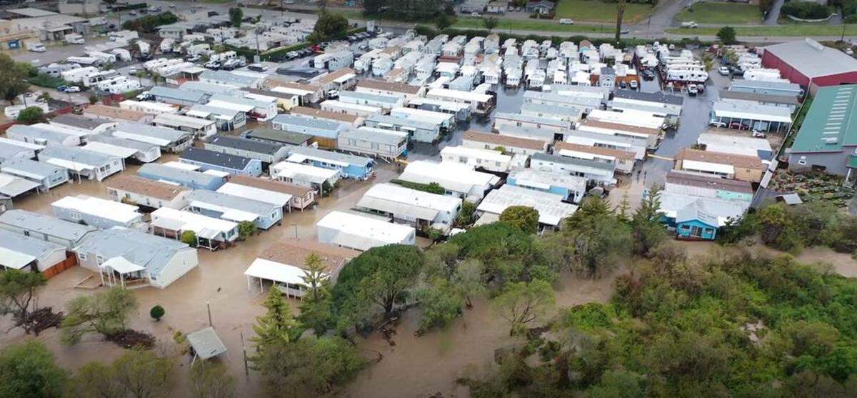 Morro Creek jumped its banks and flooded the Silver City mobile home community and surrounding businesses on March 10. Highway 41 can be seen in the background.
