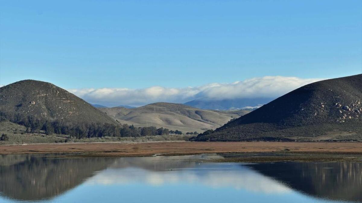 Low clouds hover over the Santa Lucia Mountains in this photo taken from Morro Bay.