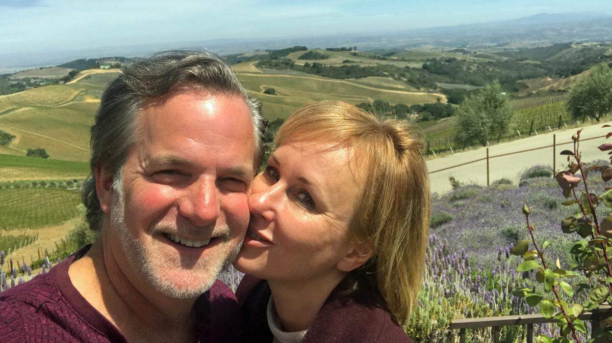 About-to-be married couple Sean Tanner and Jenny Hayes seal it with a kiss during a tour of a hilltop winery in April 2021.