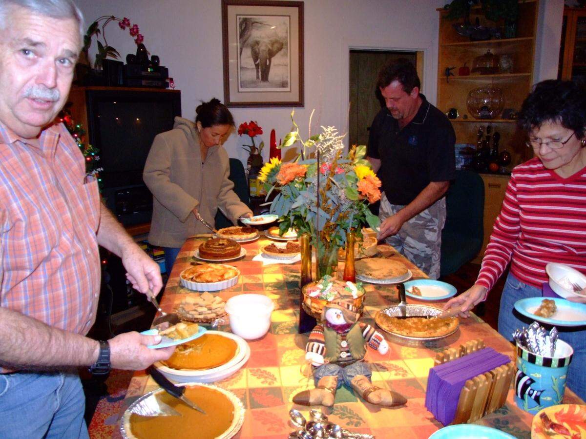 Various people joined the Tanner family in 2007 for a Thanksgiving night dessert buffet, including some who hadn’t been able to be there for the entire meal. Columnist Kathe Tanner said she still has and uses the tablecloth and the scarecrow.