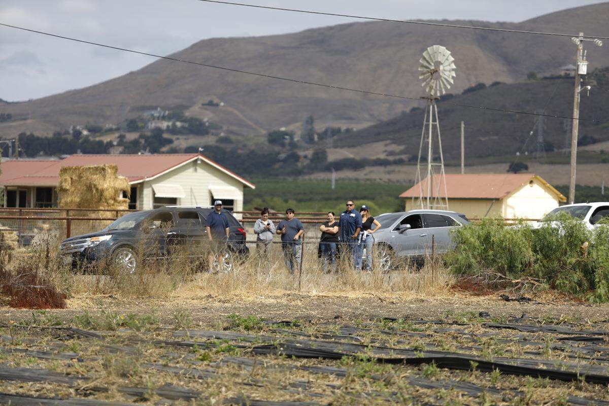 Parents wait to pick up their children from Nipomo High School on Sept. 19, 2024. The school sheltered in place after receiving an anonymous threat.