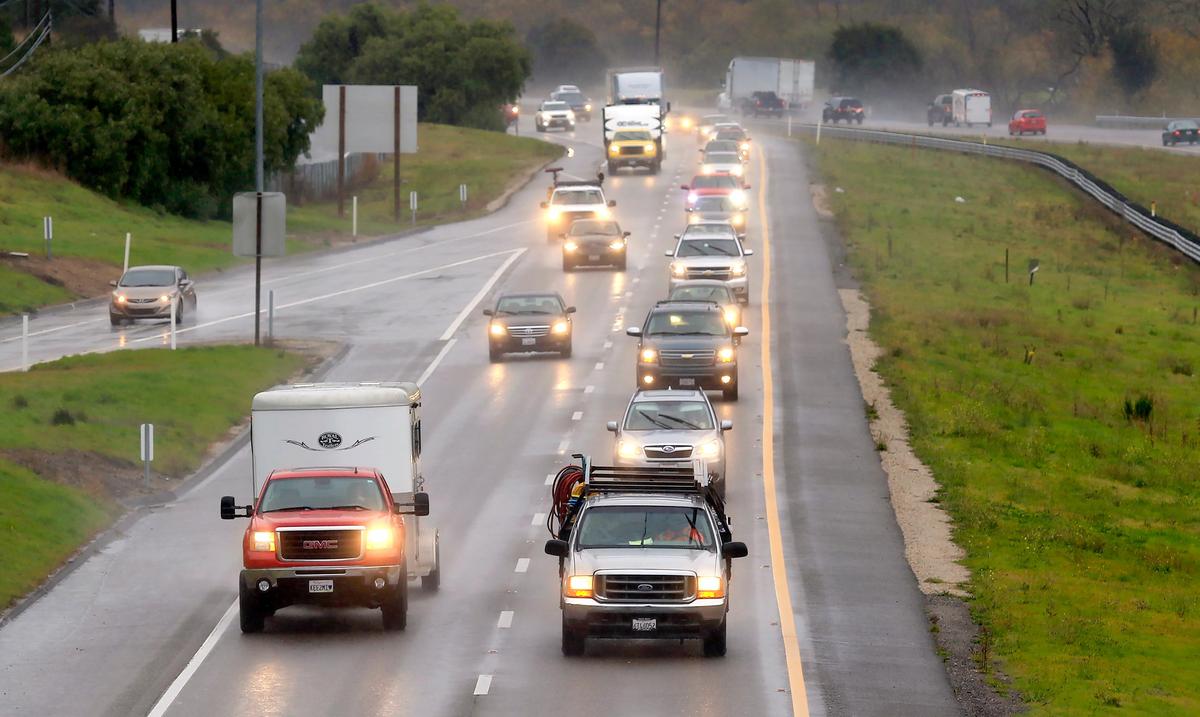 Light rain falls Thursday, Jan. 16, 2020, on a slick Highway 101 near San Luis Bay Drive in Avila Beach.