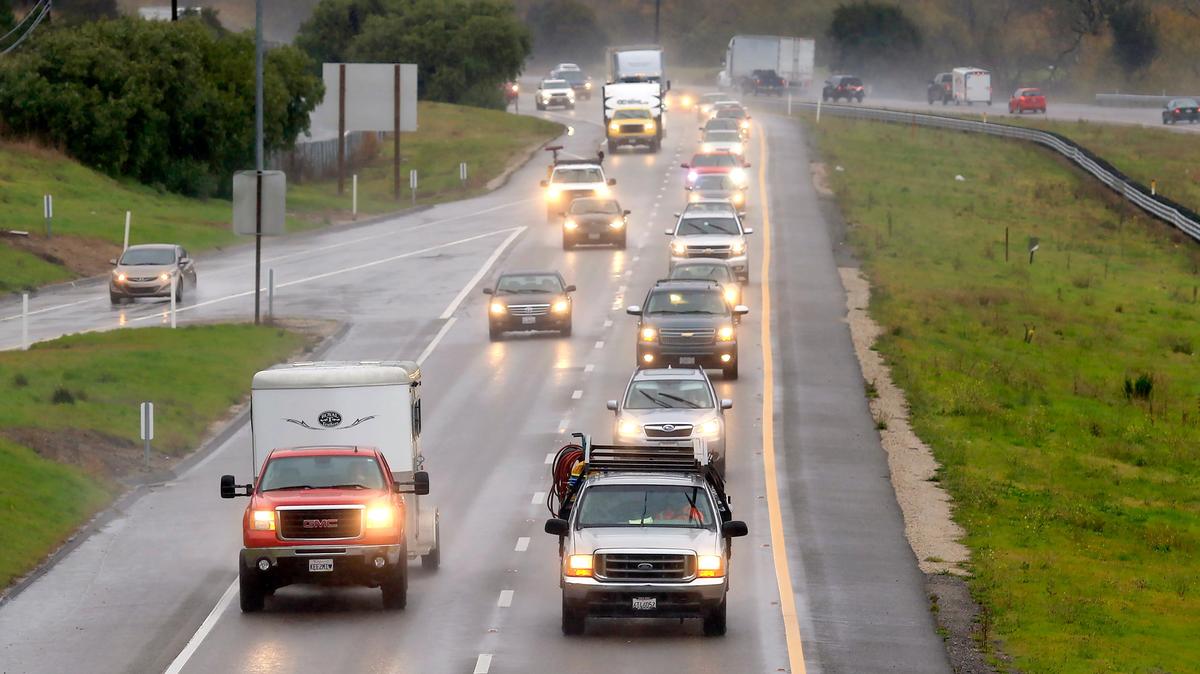Light rain falls Thursday, Jan. 16, 2020, on a slick Highway 101 near San Luis Bay Drive in Avila Beach.