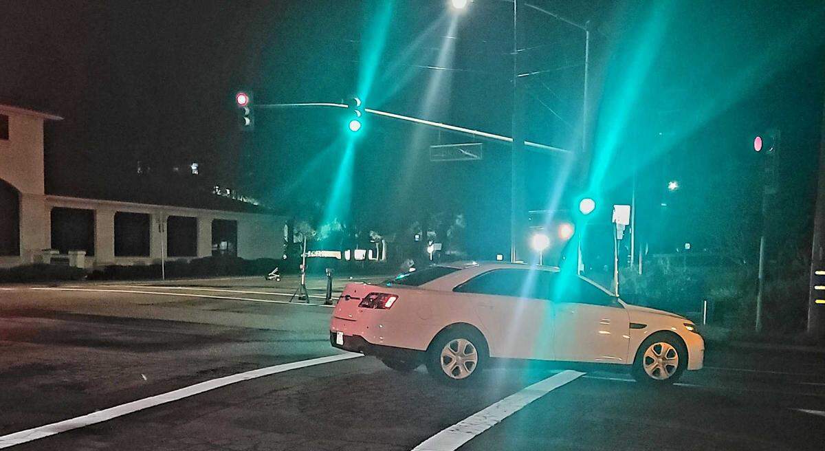 San Luis Obispo police investigate the scene of a deadly crash that killed a cyclist on South Higuera Street on Saturday night, Feb. 11, 2023.