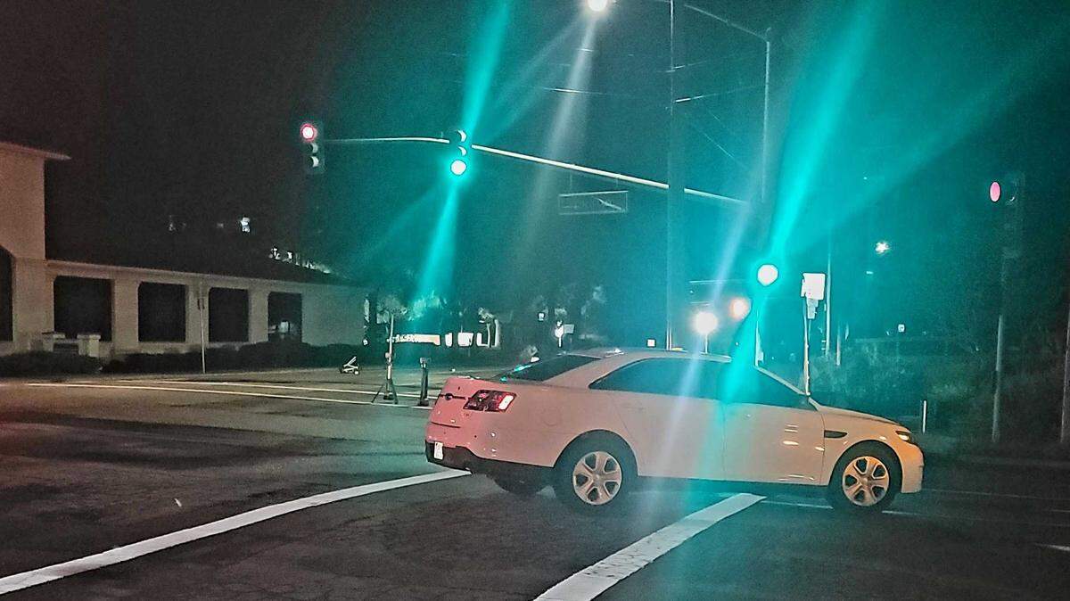 San Luis Obispo police investigate the scene of a deadly crash that killed a cyclist on South Higuera Street on Saturday night, Feb. 11, 2023.